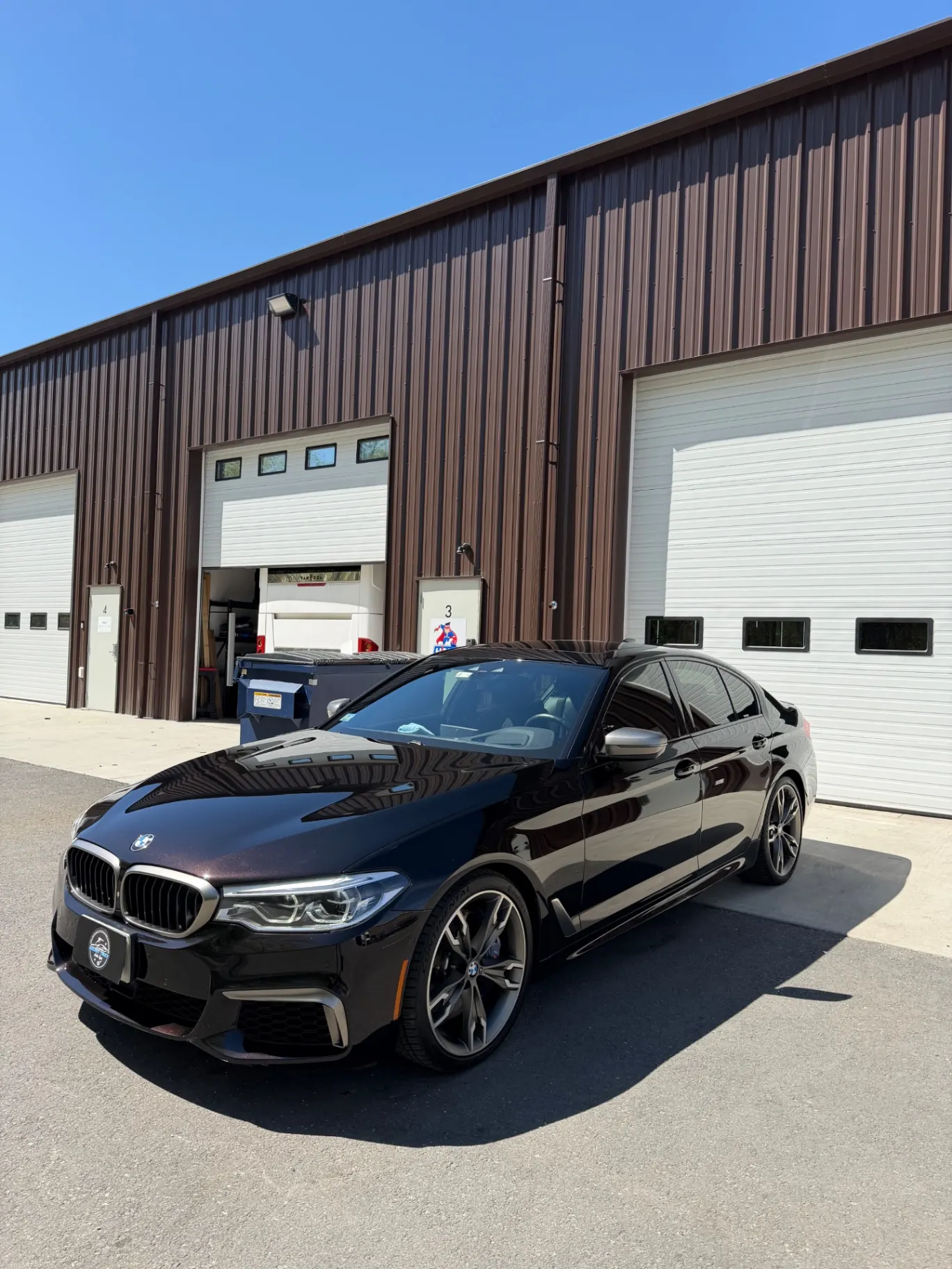 BMW M550i black ceramic coating outside Secret Touch Auto Spa Shrewsbury MA