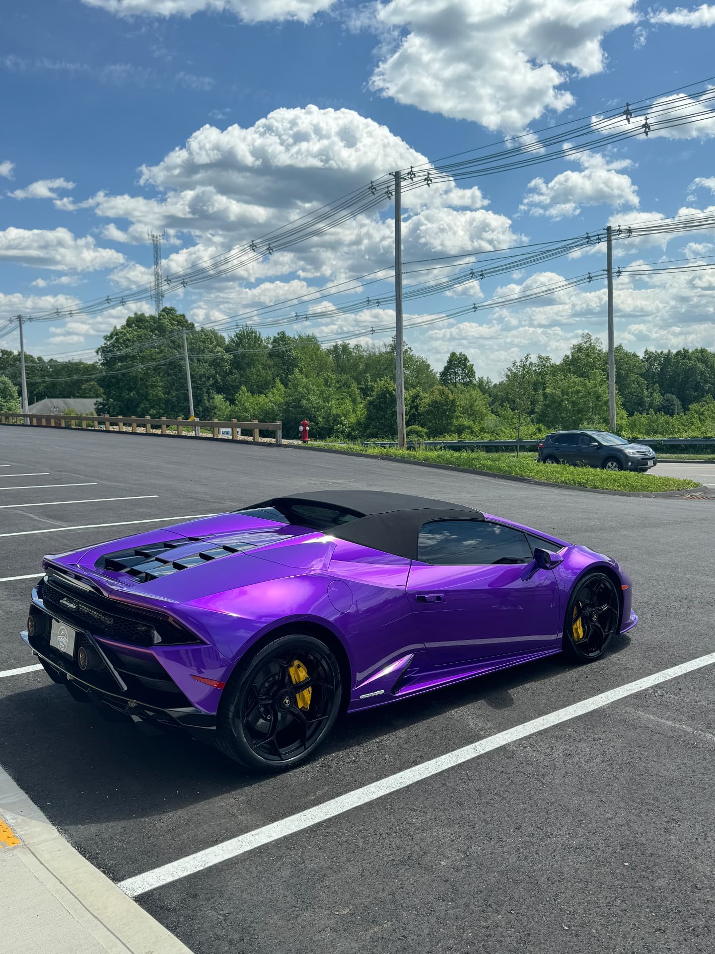 Purple Lamborghini Huracan rear quarter view after ceramic coating in Shrewsbury MA