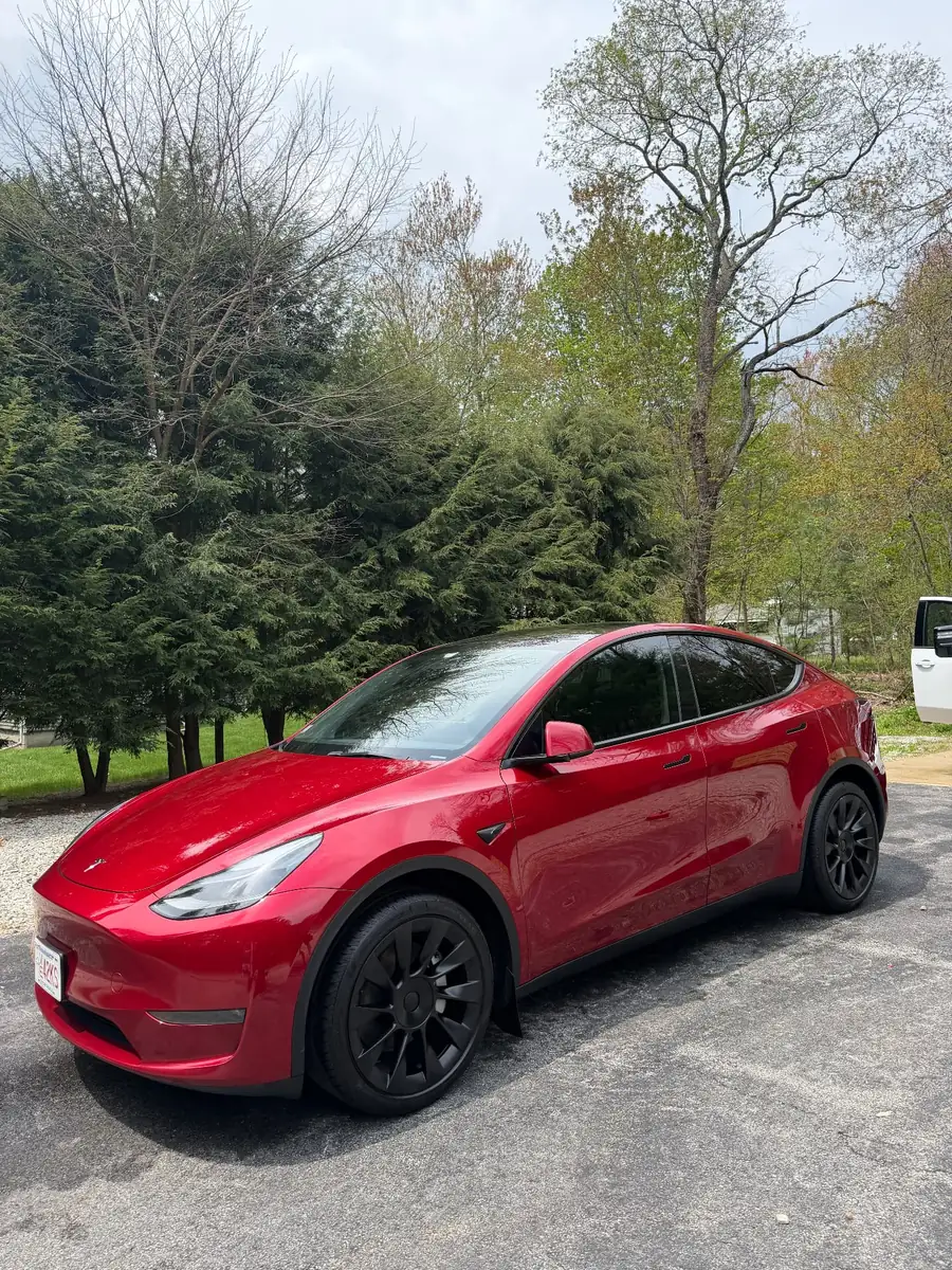 Red Tesla Model Y with ceramic coating at Secret Touch Auto Spa Shrewsbury MA