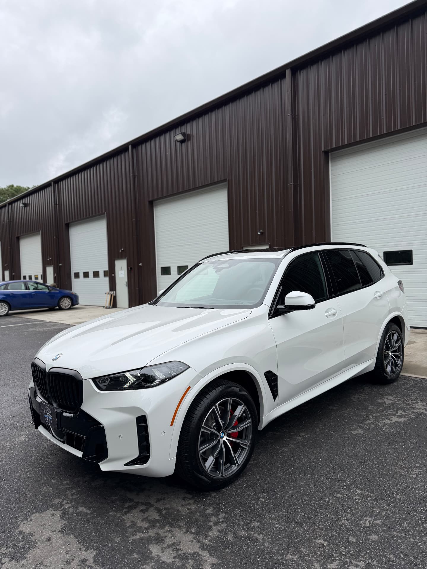 2026 BMW X5 front three quarter view after professional ceramic coating at Secret Touch Auto Spa Shrewsbury MA