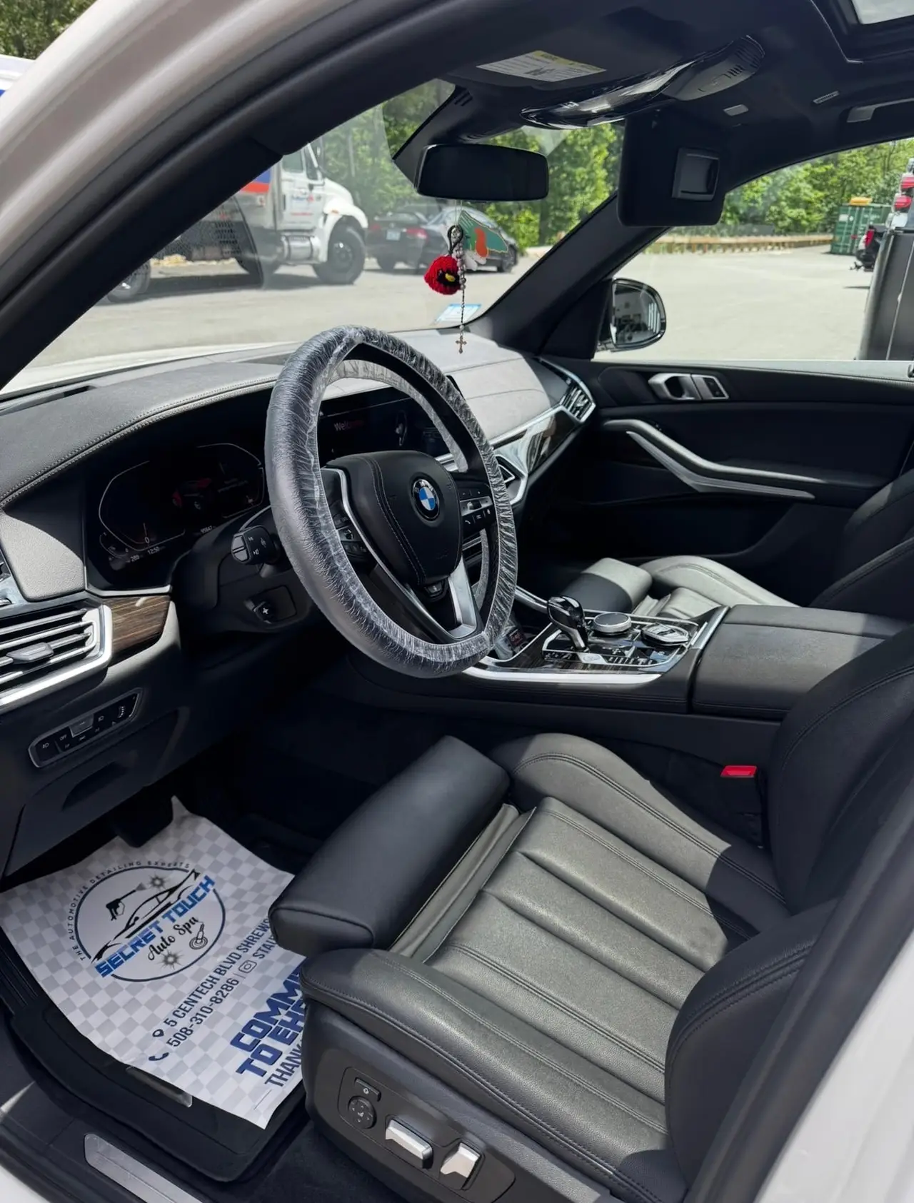 After - BMW X5 white interior driver seat before and after detailing Shrewsbury MA