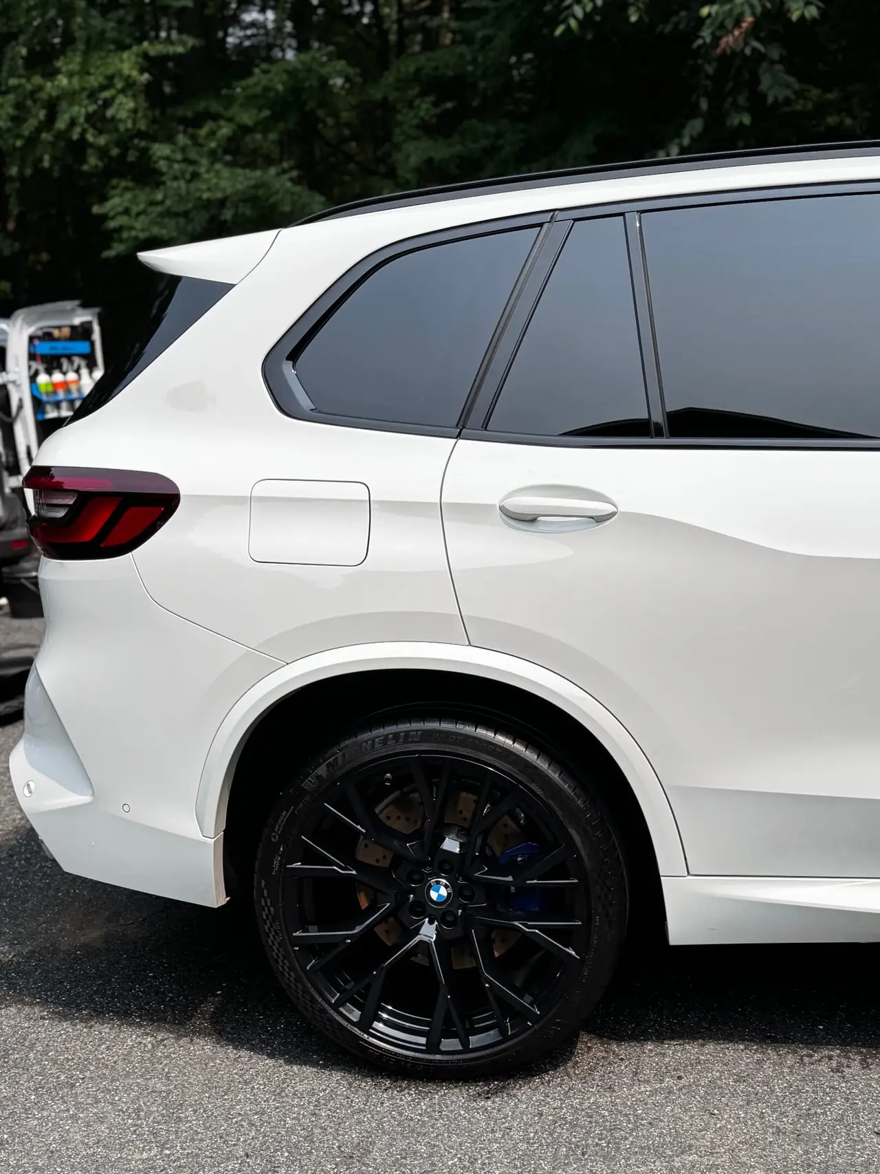 BMW X5M rear gloss black powder coated wheel closeup