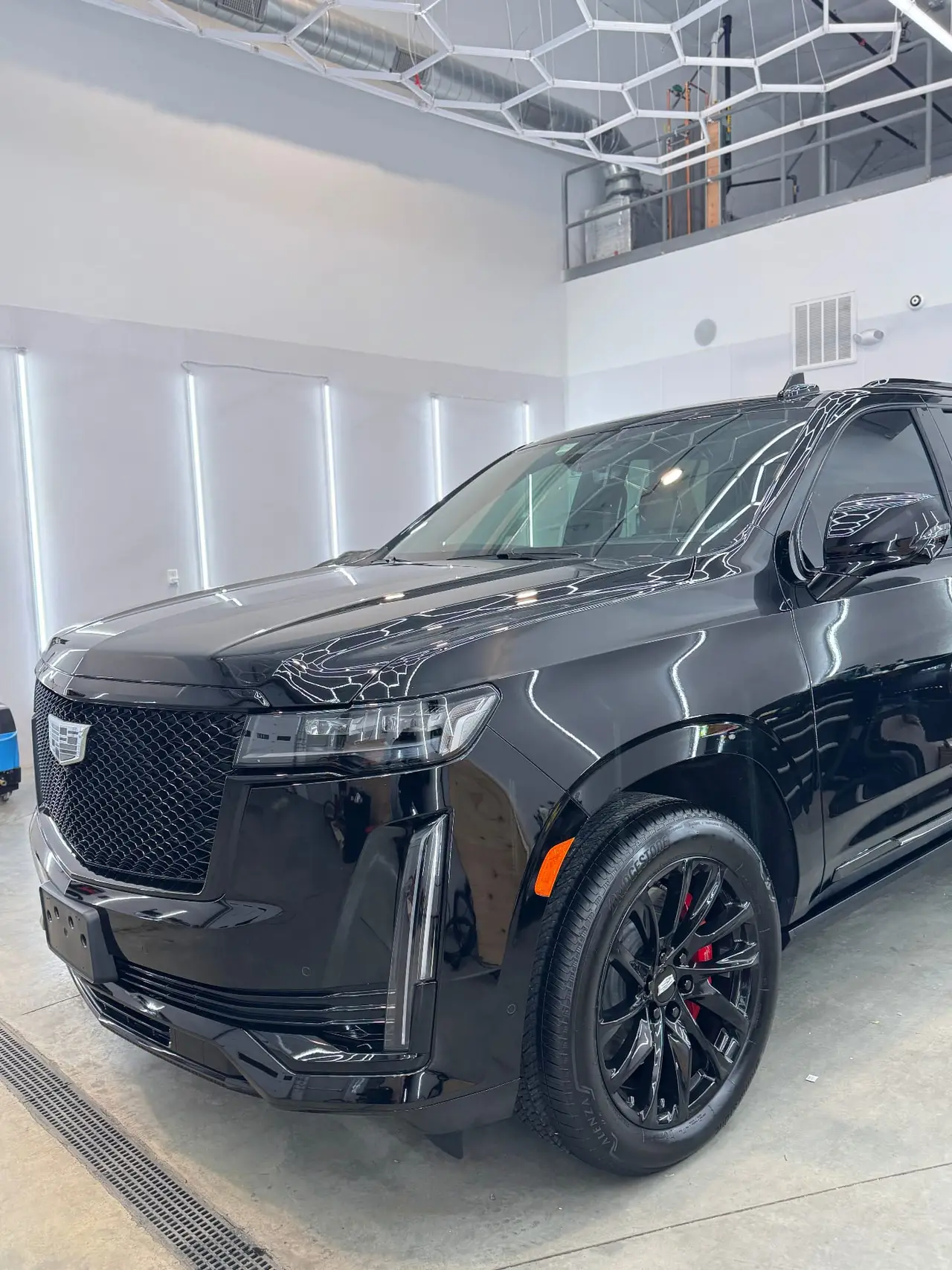 Cadillac Escalade gloss black powder coated wheels at Secret Touch Auto Spa Shrewsbury MA