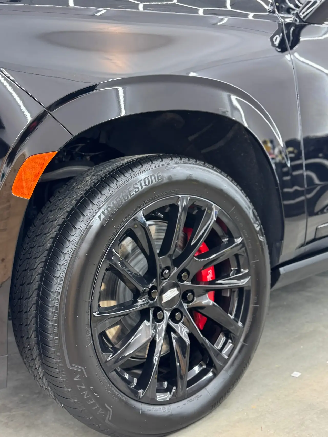 Cadillac Escalade gloss black powder coated wheel closeup