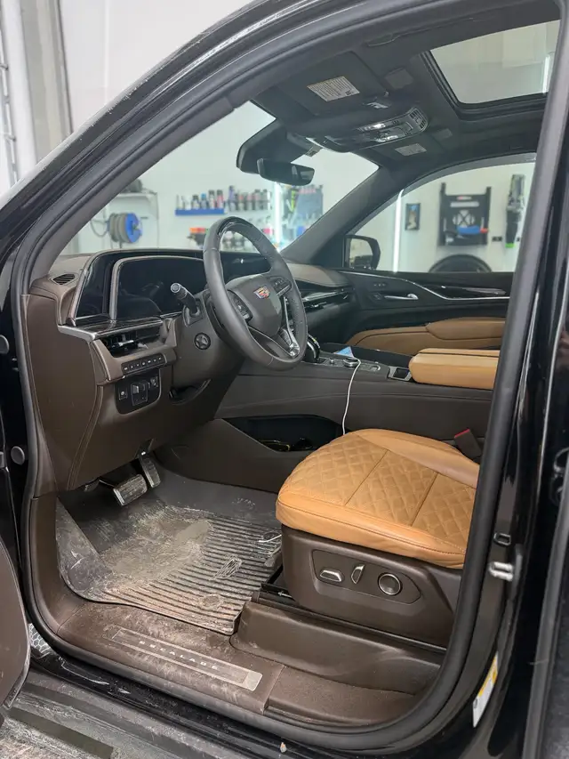 Before - Cadillac Escalade interior driver seat before and after detailing Shrewsbury MA