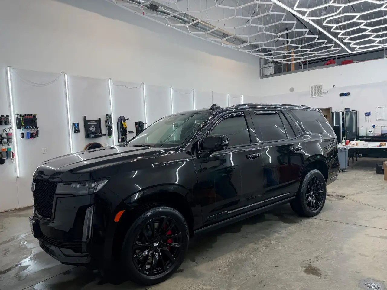 After - Cadillac Escalade-V black exterior side before and after detailing Shrewsbury MA
