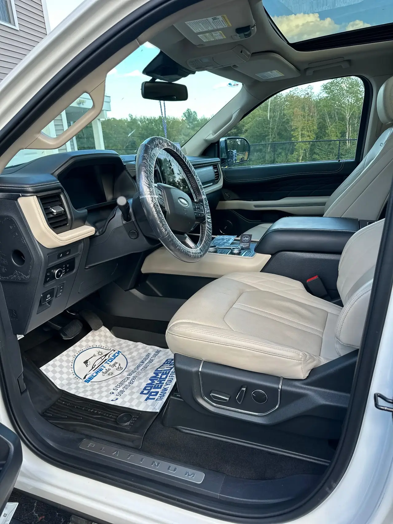After - Ford Expedition Platinum interior driver side before and after detailing Shrewsbury MA