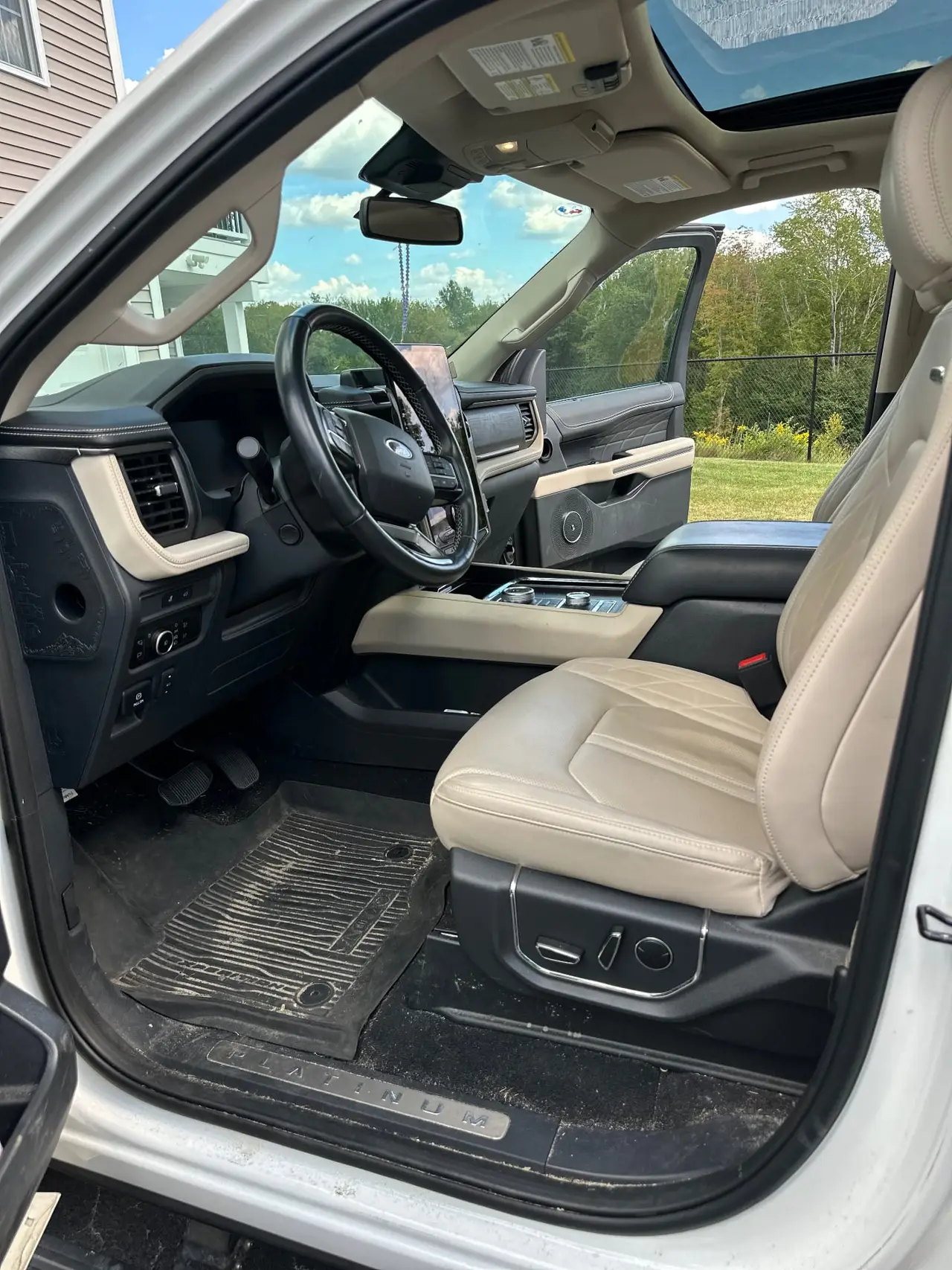 Before - Ford Expedition Platinum interior driver side before and after detailing Shrewsbury MA
