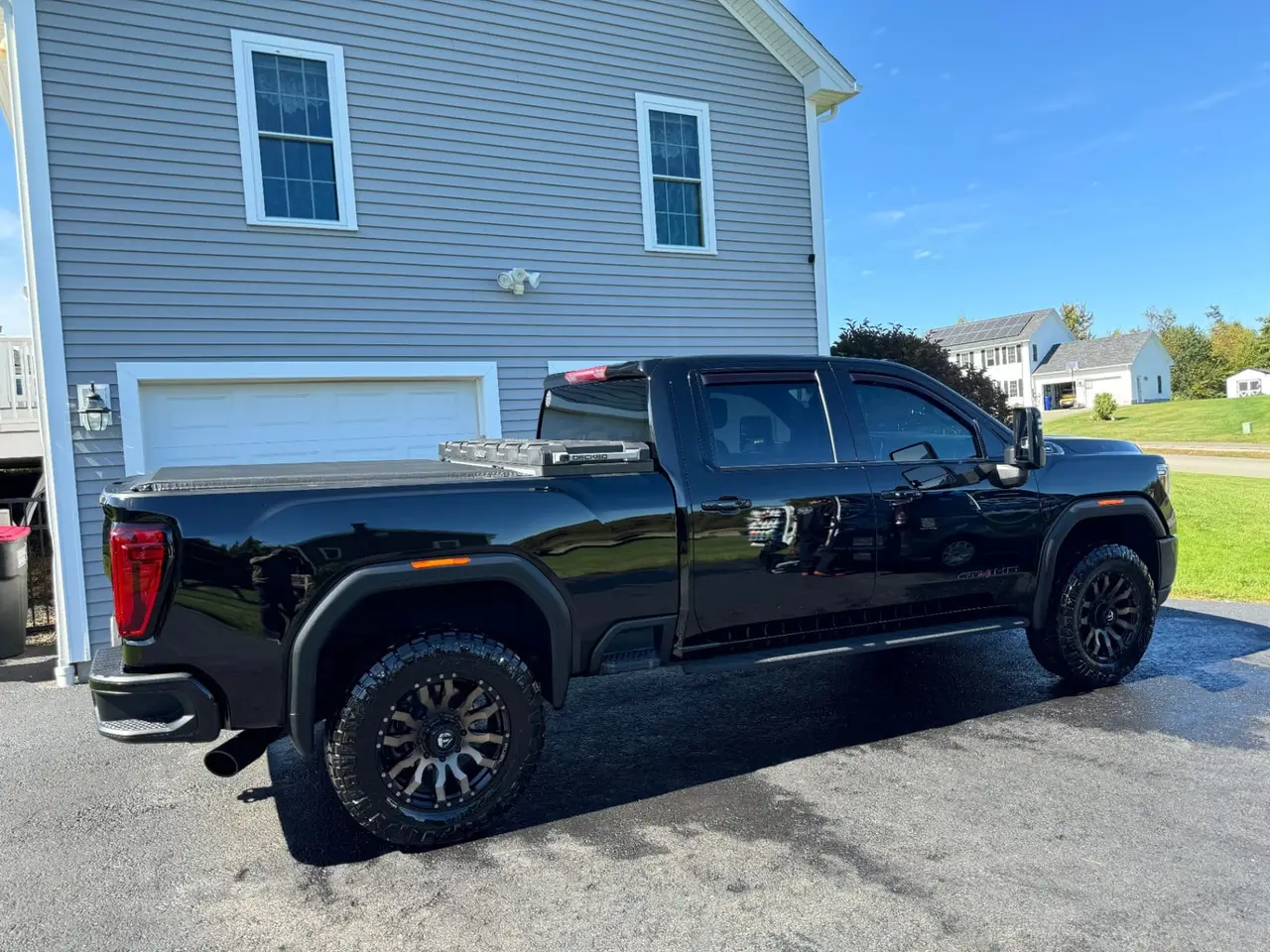 Black GMC Sierra HD truck mobile detailing at residential home