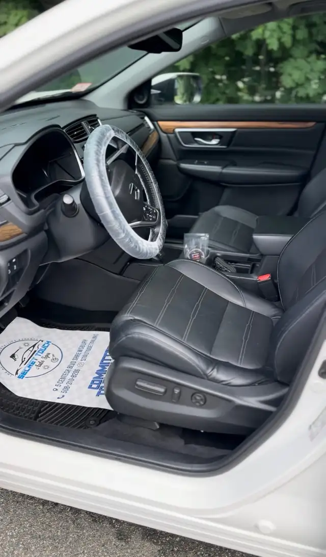 After - Honda CR-V white interior driver seat before and after detailing Shrewsbury MA