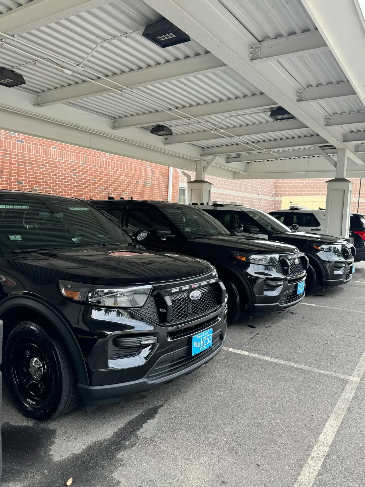 Police fleet vehicles covered parking after detailing Worcester County