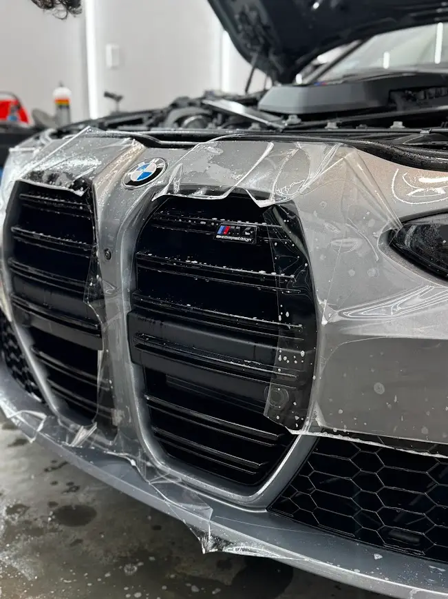 Paint Protection Film installation on luxury vehicle at Secret Touch Auto Spa Shrewsbury MA