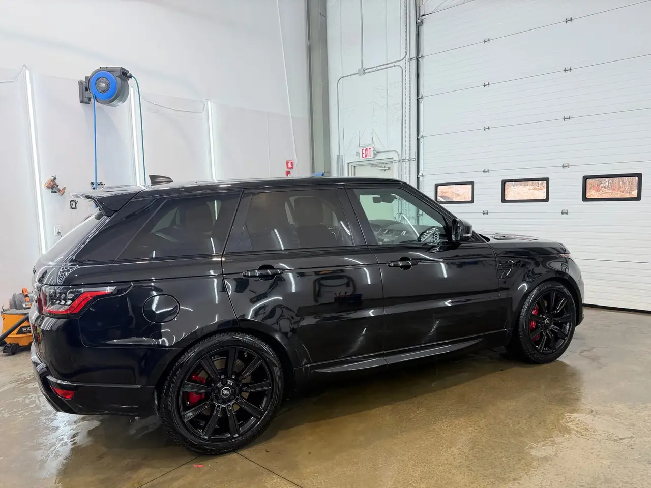 After - Range Rover Sport SVR black exterior side before and after detailing Shrewsbury MA
