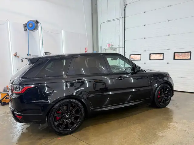 After - Range Rover Sport SVR black exterior side before and after detailing Shrewsbury MA