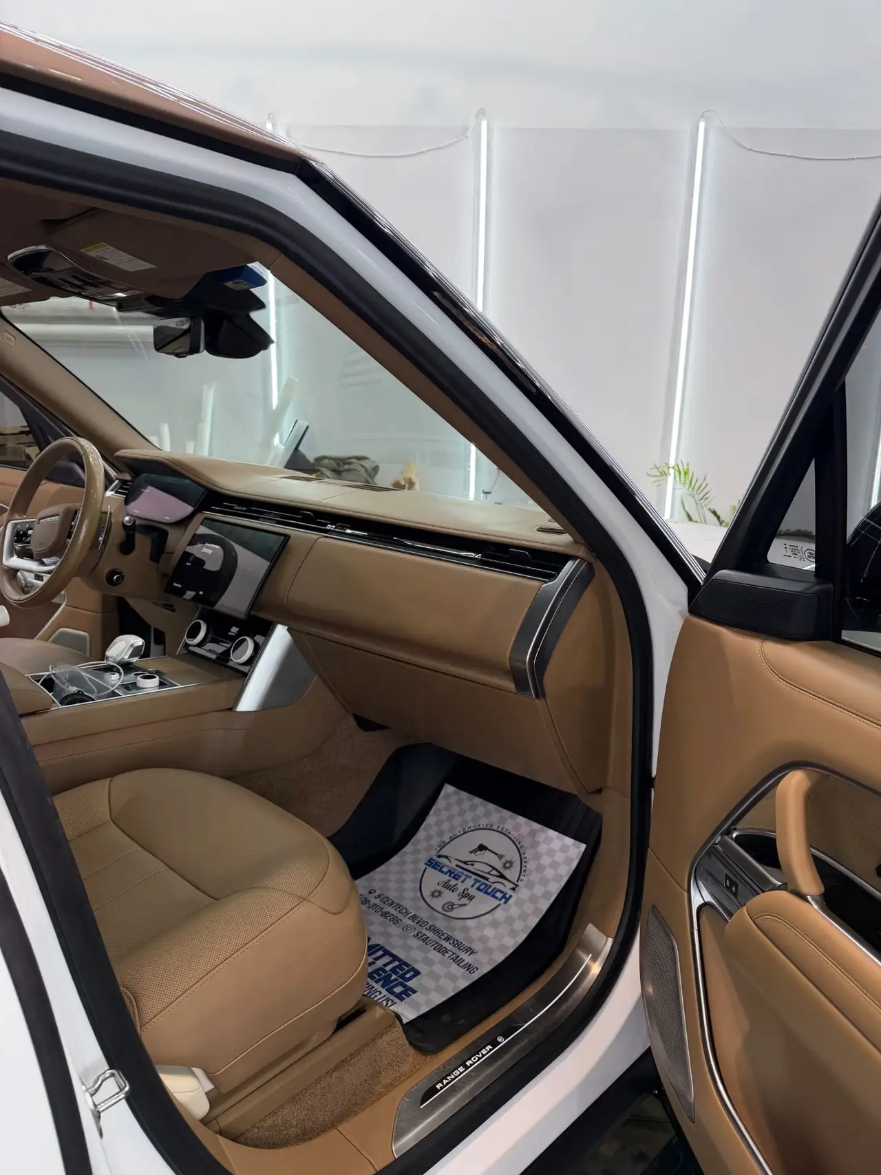 After - Range Rover tan leather interior passenger side before and after detailing Shrewsbury MA