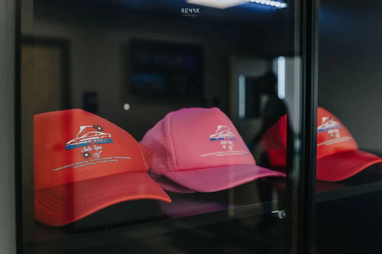 Secret Touch Auto Spa branded merchandise and hats
