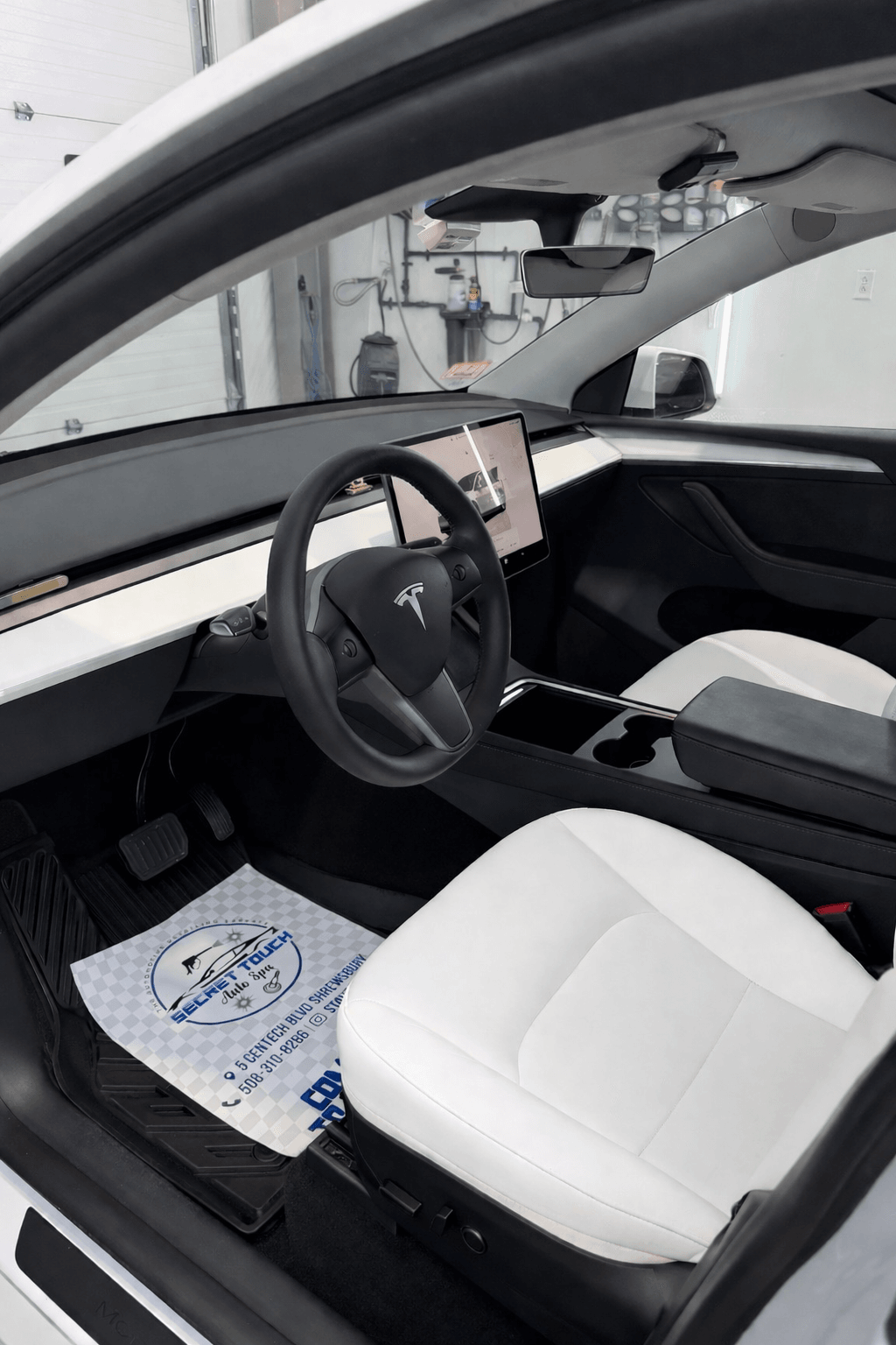 After - Tesla Model 3 white interior driver seat before and after detailing Shrewsbury MA