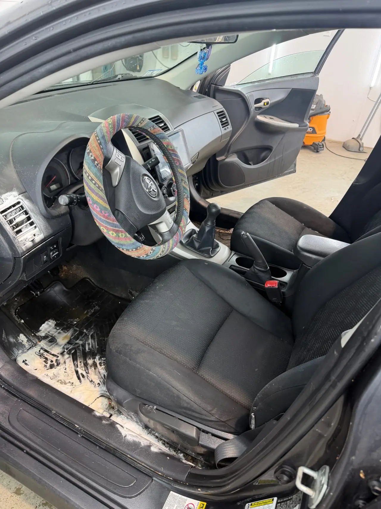 Before - Toyota Corolla interior driver seat before and after detailing Shrewsbury MA